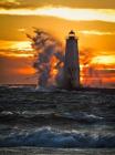 Crashing waves against a lighthouse